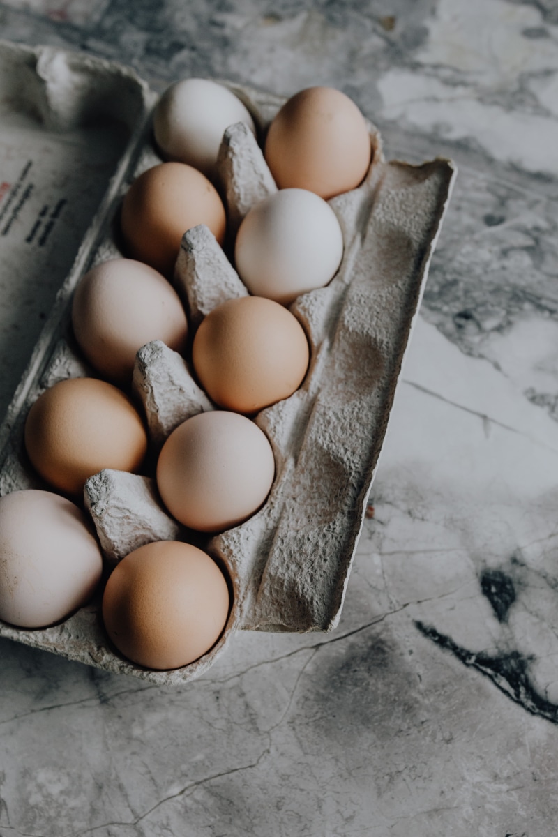 above, table, no people, fragility, close-up, indoors, container, wellbeing, raw food, organic, easter, fresh, still life, egg, high angle view, vulnerability