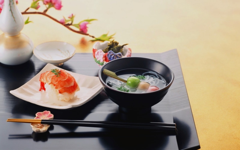 freshness, bowl, food and drink, high angle view, still life, indoors, plant, flowering plant, ceramic, garnish, flower, sashimi, asian food, table, black