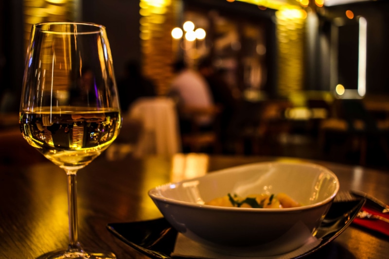 bottle, focus on foreground, dining, close up, crockery, meal, 4K, indoors, food, drink, no people, silverware, wineglass, lunch, luxury, alcohol, restaurant