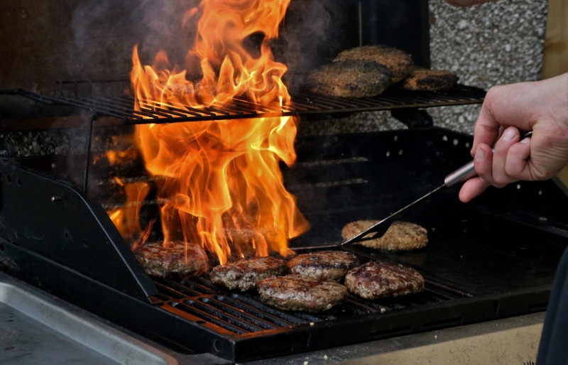 freshness, real people, burning, food, heat - temperature, Fire, flame, preparation, nature, kitchen utensil, outdoors, preparing food, human body part