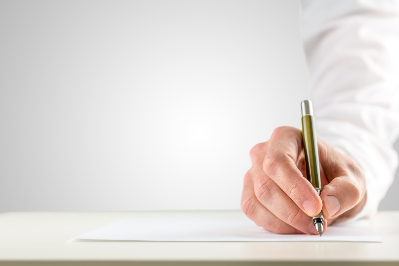 hand, document, entrepreneur, contract, writing instrument, note pad, professional occupation, copy space, lab coat, adult, paper, furniture, men, human hand