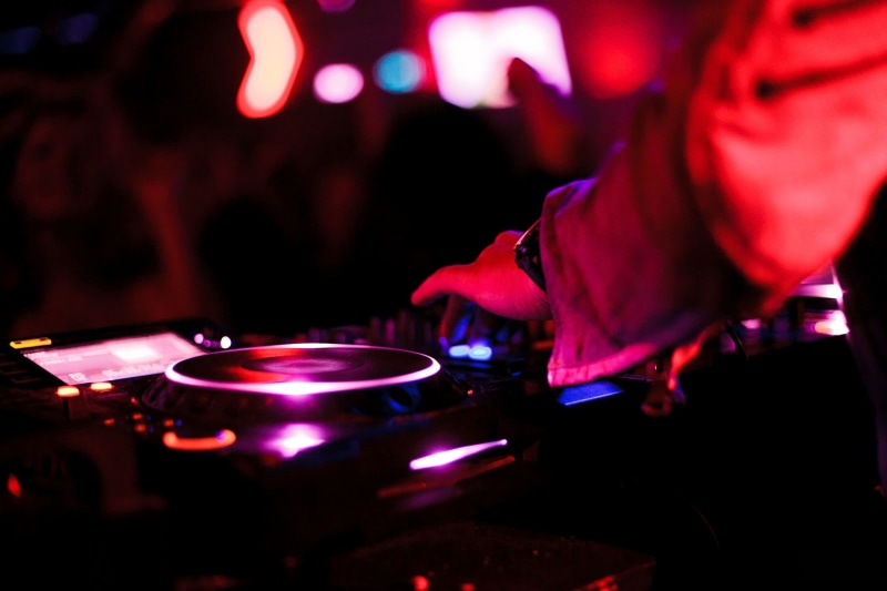 human body part, dj, night, entertainment club, hand, human hand, indoors, red, music, technology, enjoyment, record, one person, occupation, led, black