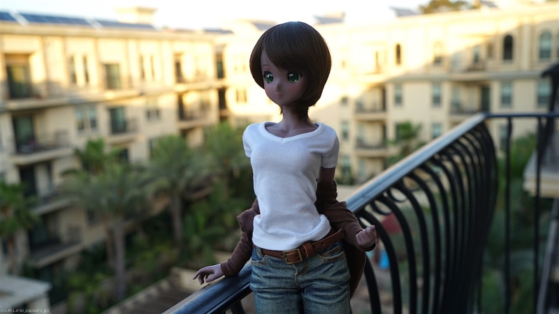 lifestyles, creepy, railing, house, green  eyes, looking at camera, Smart Doll, sweater, innocence, palm trees, building exterior, child, city, sunlight