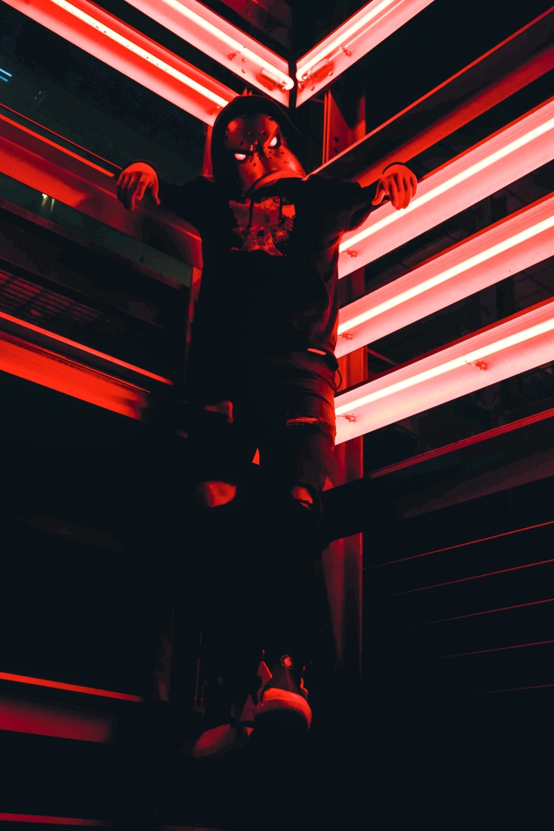 hanging, photography, corner, mask, red light, lighting equipment, masked person, red, craft, low, illuminated, portrait, architecture, outdoors, wearing