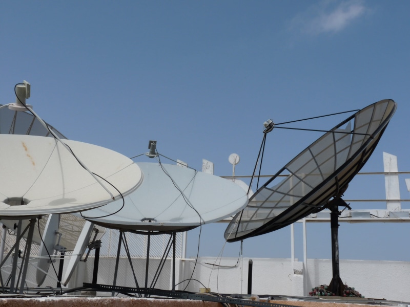 tv antenna, sunlight, clear sky, low angle view, sky, day, Communication, outdoors, mobile, built structure, tv, white, skies, satellite, water, global communications