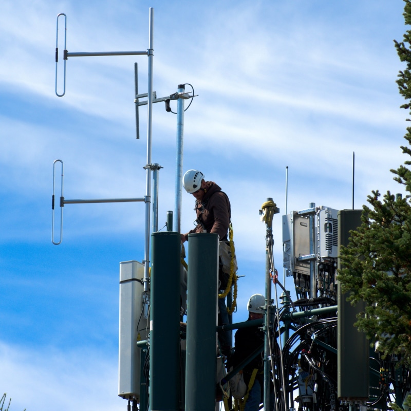 electromagnetic, working, building exterior, men, mobile, wyoming, mountain, signal mountain cell tower, cloud - sky, signal, technology, people, workers