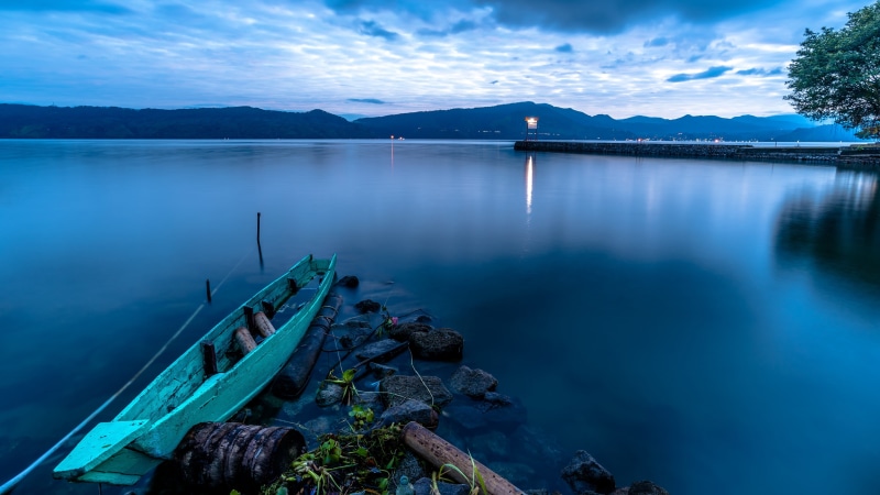 boat, mountain, sky, body, solid, water, beauty in nature, teal, Indonesia, transportation, rock - object, non-urban scene, no people, outdoors, scenics - nature