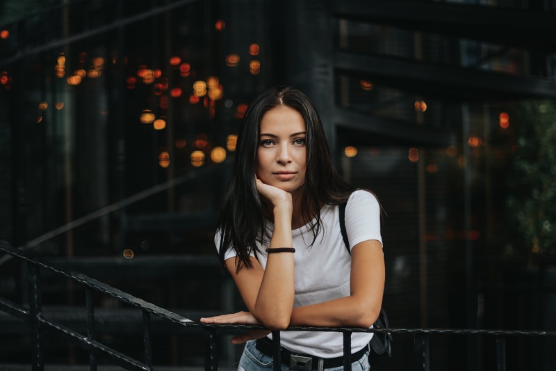 railing, crew, night, contemplation, street, young adult, palm, style, woman, lifestyles, front view, looking at camera, famou, neck, long hair, dark, beautiful woman
