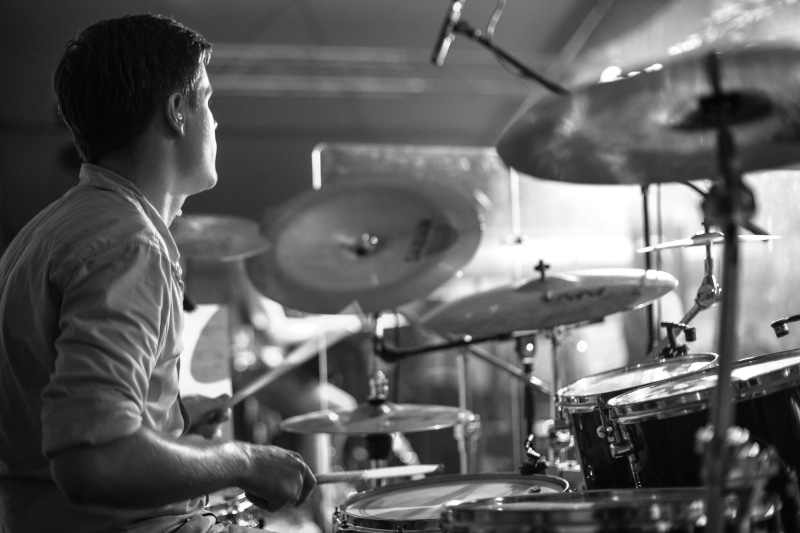 males, young men, drumstick, close up, drum sticks, man, hearing protection, occurs, drums, intruments, musical equipment, people, young adult, sticks