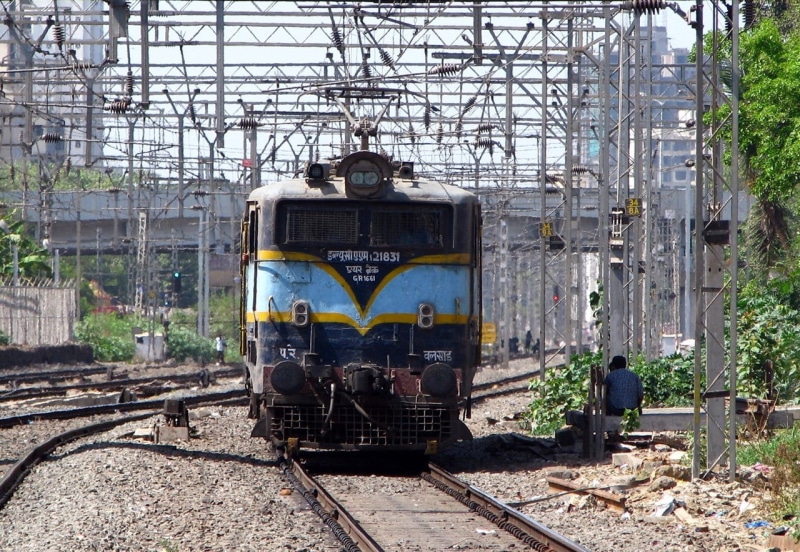 land vehicle, abandoned, old, outdoors, rail transportation, blue, obsolete, damaged, pantograph, day, no people, tracks, electric locomotives, teal, run-down