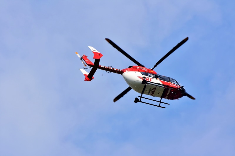 ambulance helicopter, transportation, clear sky, ambulance service, accident rescue, low angle view, motion, emergency, airplane, mountain rescue, propeller