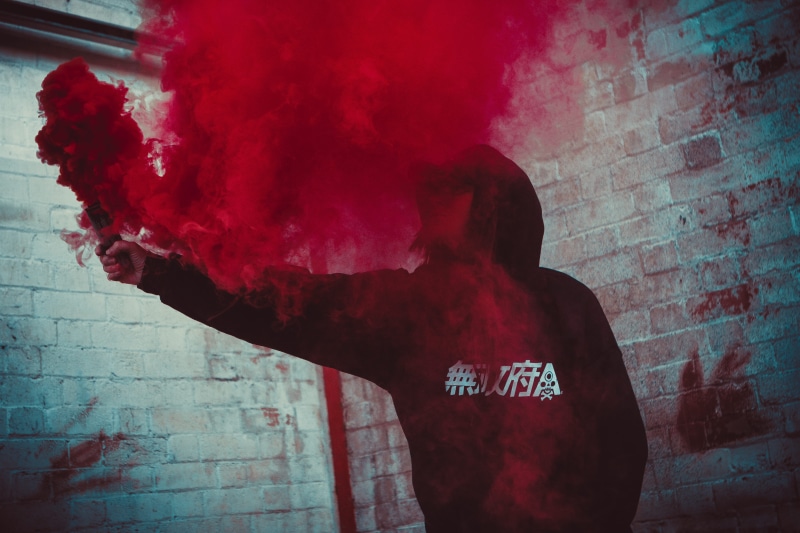 wall - building feature, men, real people, young adult, obscured face, headshot, waist up, bonb, paint, adult, indoors, young men, hairstyle, smoke, holding