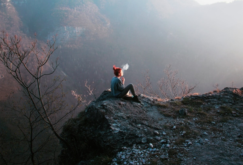 rock, 1080P, beauty in nature, hiking, smoke, sitting, rock - object, outdoors, day, solid, nature, top, mountain, tree, one person, leisure activity
