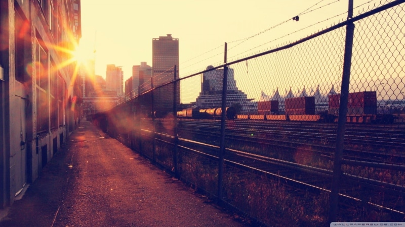 built structure, city, railway, sunset, architecture, lens flare, building, rail transportation, railroad track, building exterior, sky, nature, no people