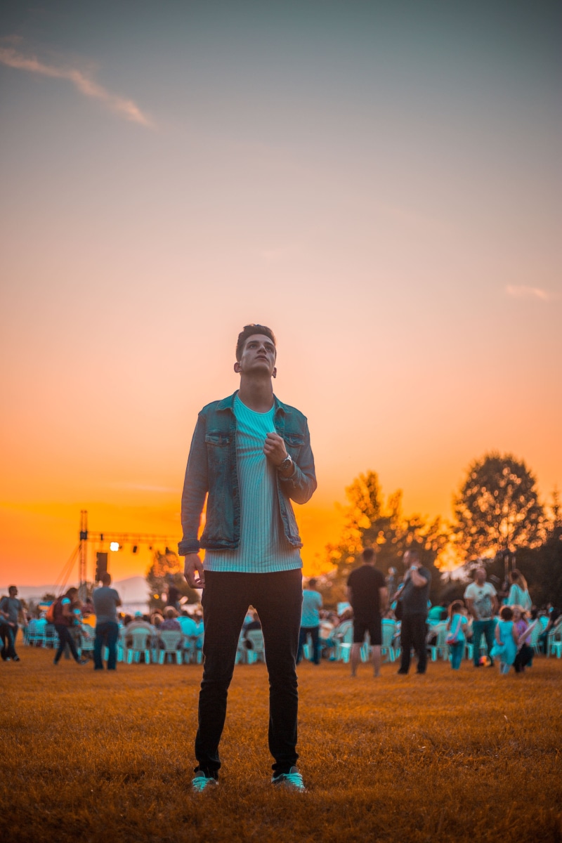dawn, clothing, human, full length, standing, golden, building, upward, young adult, crowd, leisure activity, young men, sunrise, flare, real people, one person