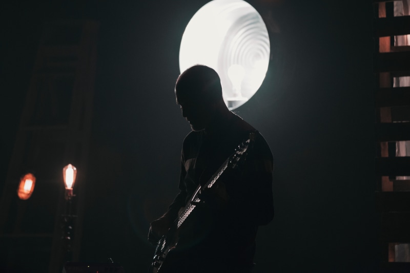 one man only, only men, adult, sound, musician, holding, men, band, music, playing, night, standing, bulb, dark, indoors, lifestyles, architecture, people