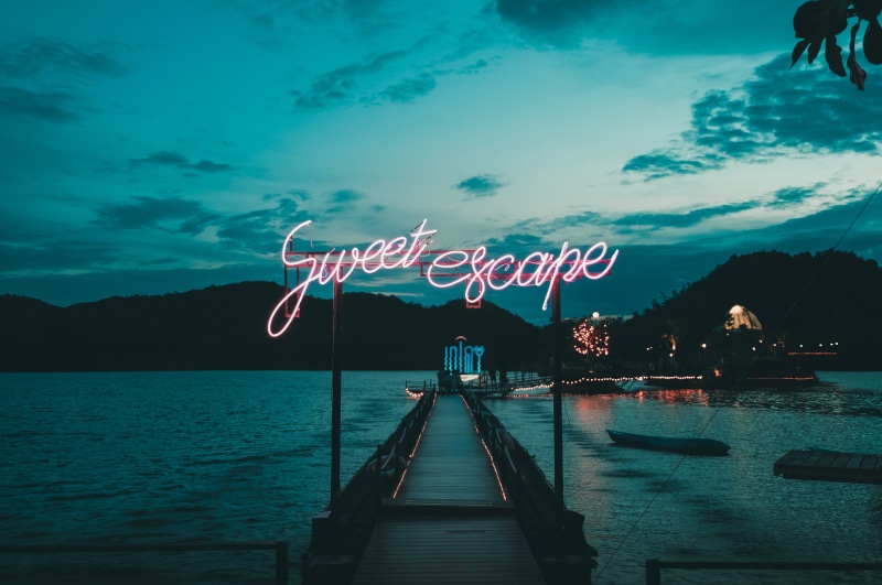scenics - nature, signboard, communication, water, sweet, sign, neon, sea, western script, text, beauty in nature, outdoors, nature, architecture, escape
