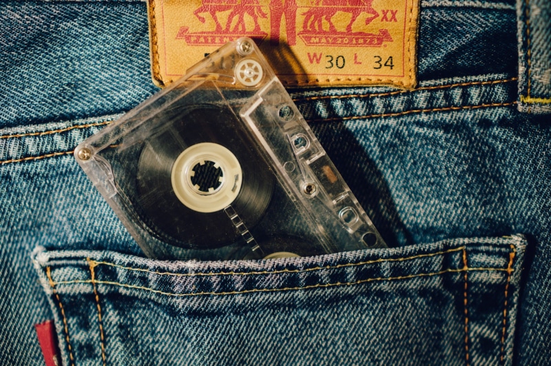 textile, indoors, no people, button, high angle view, denim, close-up, clothing, jeans, tape, clear, 1080P, text, cassette, pockey, technology, directly above