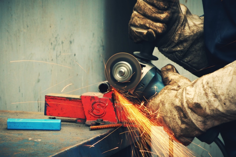 motion, glove, real people, equipment, holding, spark, work, metal industry, one person, protective glove, working, hand, person, bar, skill, welding, sparks
