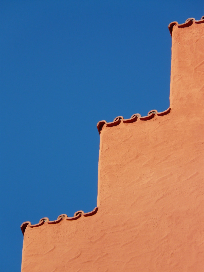square, edge, stone, angular, travel, wall - building feature, tile, nature, copy space, clear sky, outdoors, 2K, red, architecture, wall, blue, low angle view