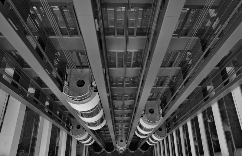 lighting equipment, steps and staircases, ceiling, business, angular, luxury, directly below, architecture, no people, commercial, tower, architectural feature