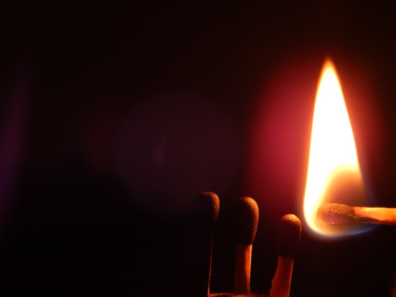 glowing, orange color, copy space, indoors, candle, matchstick, close-up, matches, black background, fire - natural phenomenon, extreme close-up, illuminated