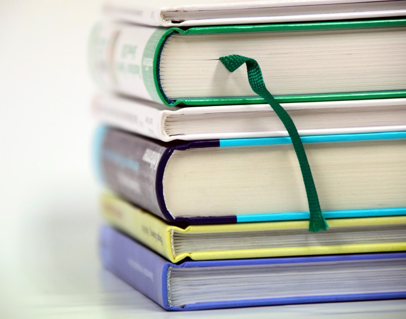 title, books, box, white background, close-up, studio shot, bound books, stacked, school, learn, publication, learning, wisdom, large group of objects