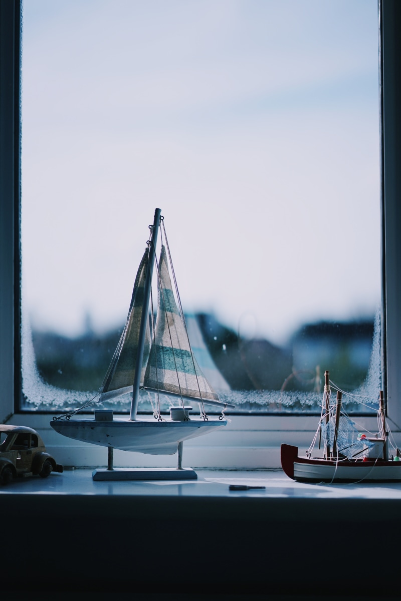 yacht, water, travel, architecture, miniatures, glass - material, bridge - man made structure, ship, display, outdoors, miniature, sail, focus on foreground