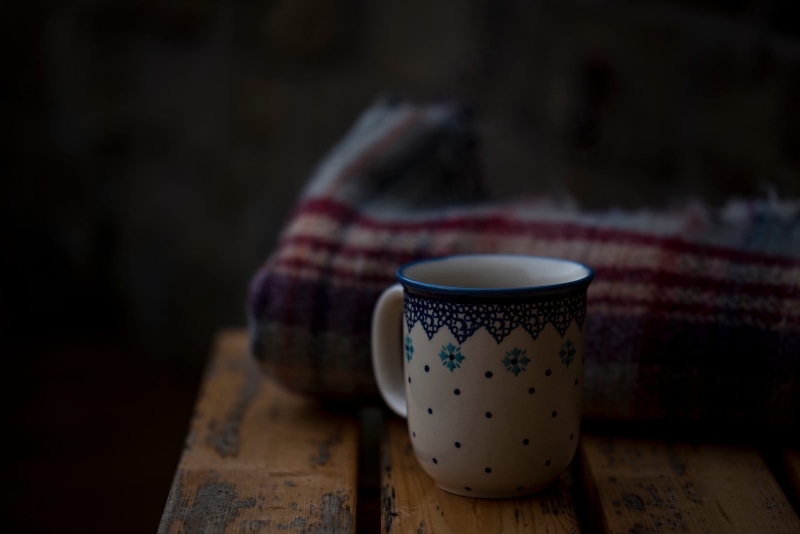 refreshment, cultures, indoors, cup, wood, hot drink, blankets, ceramic, black, tea, old-fashioned, tea - hot drink, still life, coffee, focus on foreground