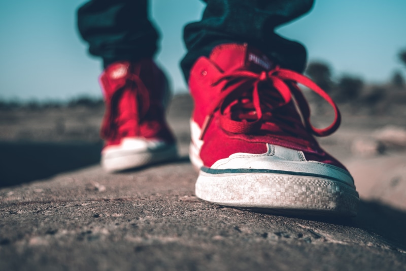 sky, pair, people, human leg, human foot, shoelaces, sneakers, blur, close-up, low angle shot, shoes, body part, red, focus, day, focus on foreground, wearing