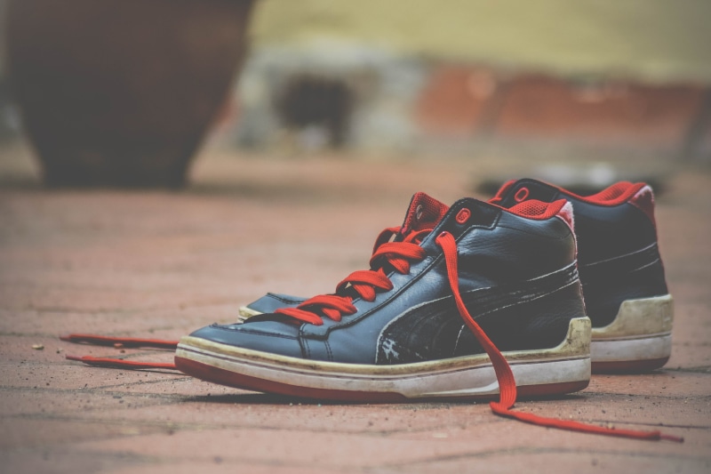 orange color, footwear, sneakers, outdoors, absence, nature, lace - fastener, shoelace, red, day, top, shoelaces, focus on foreground, selective focus