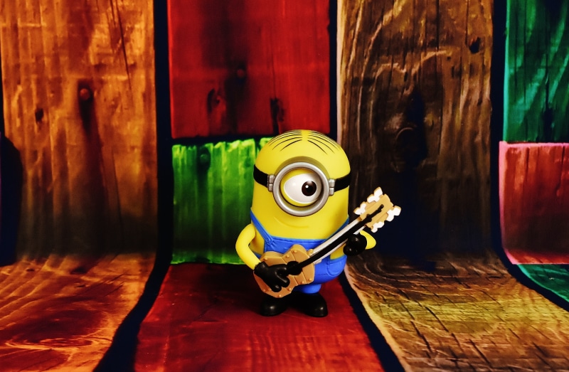 musical instrument, bob, wall - building feature, stage, minions, green color, 4K, close-up, indoors, children, no people, wood, multi colored, table