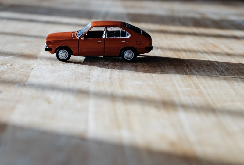 classic, surface, selective focus, surface level, car wheel, red, hatchback, vehicle, machine, motor vehicle, door, old, wood - material, alloy wheel, table