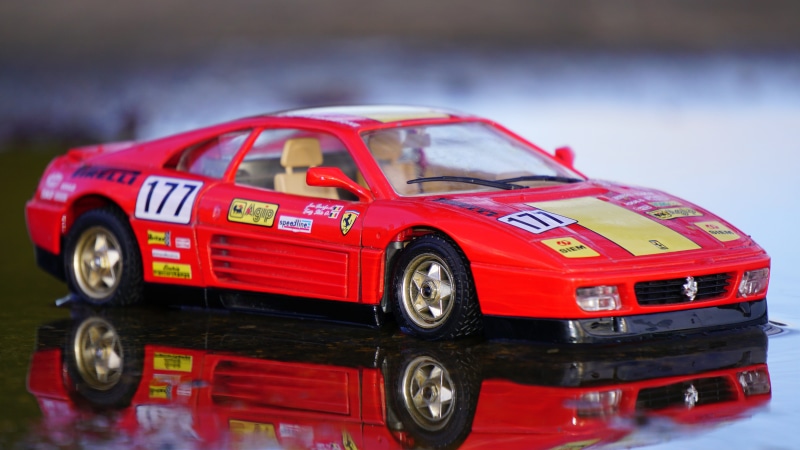 Ferrari, sports race, red, toy car, racecar, focus on foreground, car, coupe, transportation, wheel, toy, people, sports car, small, model car, close-up