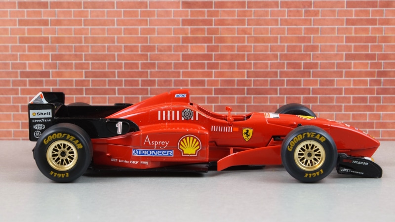 F310, pkw, toy, sports car, brick, professional sport, Ferrari, outdoors, motor vehicle, automotive, car, michael schumacher, red, vehicles, speed, no people