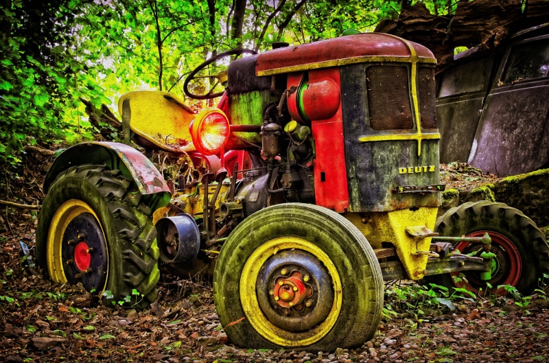 agricultural machine, tree, machinery, wreck, diesel, stationary, land vehicle, land, agricultural equipment, working machine, oldtimer, tug, woods, outdoors
