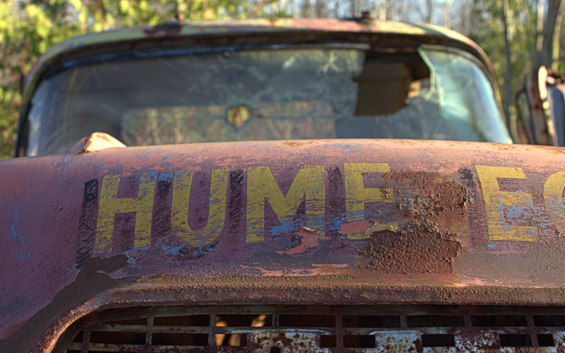 close-up, motor vehicle, architecture, focus on foreground, writing, communication, day, metal, nature, text, no people, broken, land vehicle, salvage yard