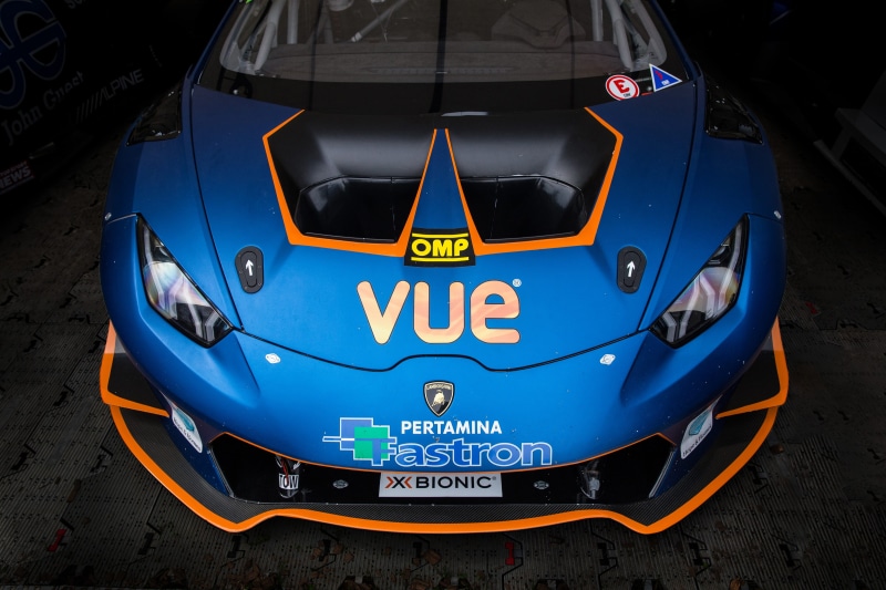 sits, outdoors, sign, power, 4K, western script, air vehicle, high angle view, illuminated, race, communication, front view, capital letter, transportation