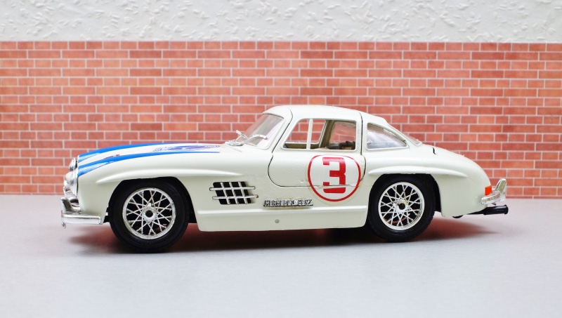 automotive, sports car, old, model, retro styled, white color, speed, classic, brick wall, competition, toys, land vehicle, gullwing, diorama, expensive