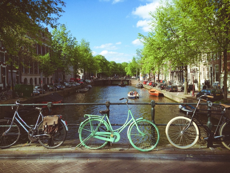 summer, cyclist, amsterdam, day, parking, travel, nautical vessel, town, urban Scene, buildings, downtown, built structure, netherlands, people, urban