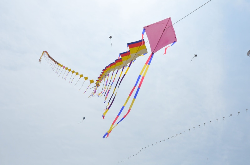 in the new year, outdoors, airplane, prayer, nature, variation, rice cake soup, cloud - sky, low angle view, blue, Kite, traditional temples, kite - toy
