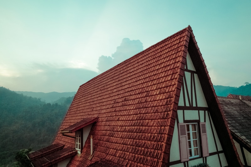 5K, architecture, outdoors, mountain, low angle view, beauty in nature, red, roof tile, nature, residential district, brick, no people, building, roof