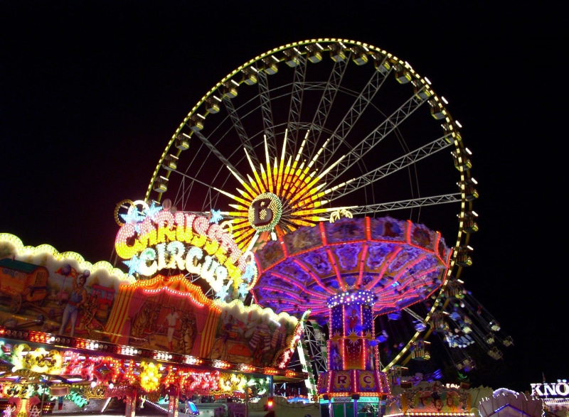 fairground, outdoors, illuminated, carousel, carnies, arts culture and entertainment, traveling carnival, fair, leisure activity, sky, fun, folk festival