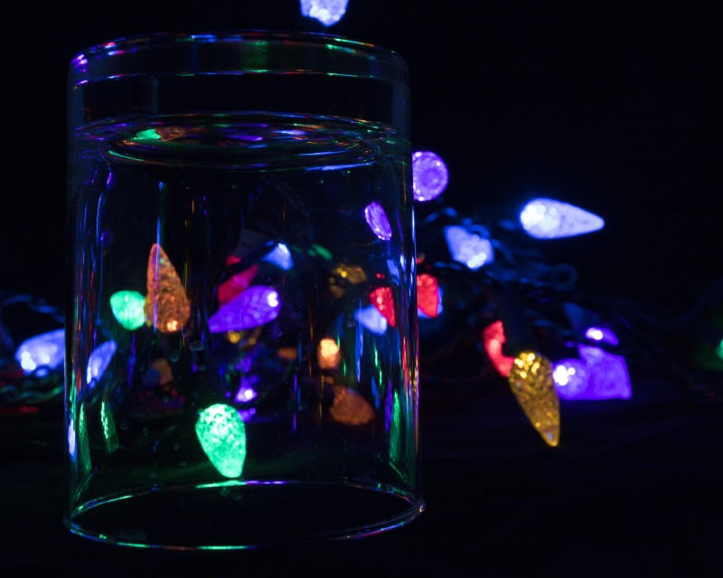 reflections, black background, artistic work, no people, household equipment, still life, glass - material, jar, christmas, christmas decorations, luxury