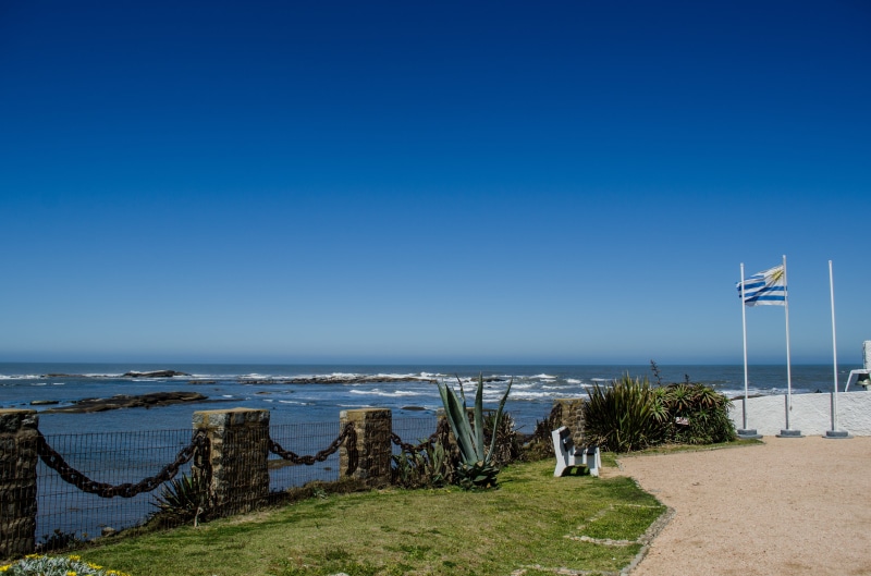 clear sky, atlantic, ocean, flag, waves, 4K, holiday, clouds, beach, montevideo, portugal, outdoors, day, rocks, calm, horizon, orange, uruguay, scenics - nature