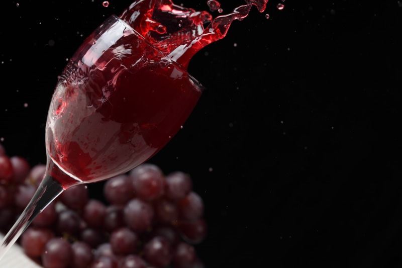 freshness, red, red Wine, grape, alcohol, wineglass, winery, glass - Material, grapes, black Color, squirt, splashing, 5K, studio shot, liquid, pouring