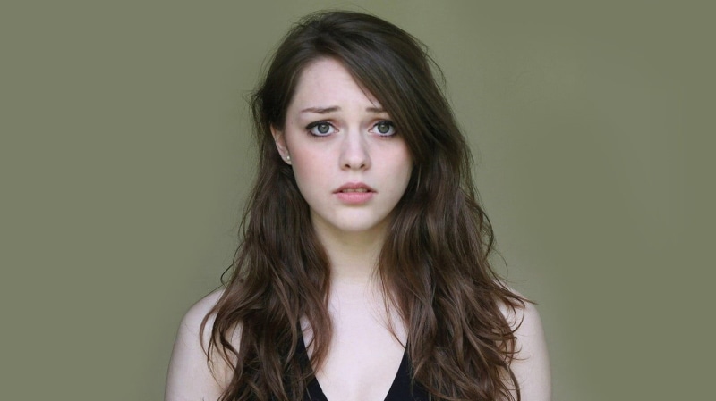 sleeveless, looking at camera, headshot, long hair, s, brown hair, portrait, top, photography, hairstyle, studio shot, 720P, teenager, young adult, colored background