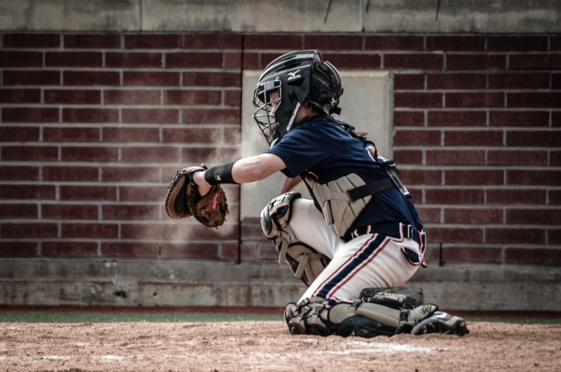 safety, equipment, real people, competition, aggression, male, playing, catch, fun, base, daytime, side view, baseball, day, child, ball, brick wall, sports equipment