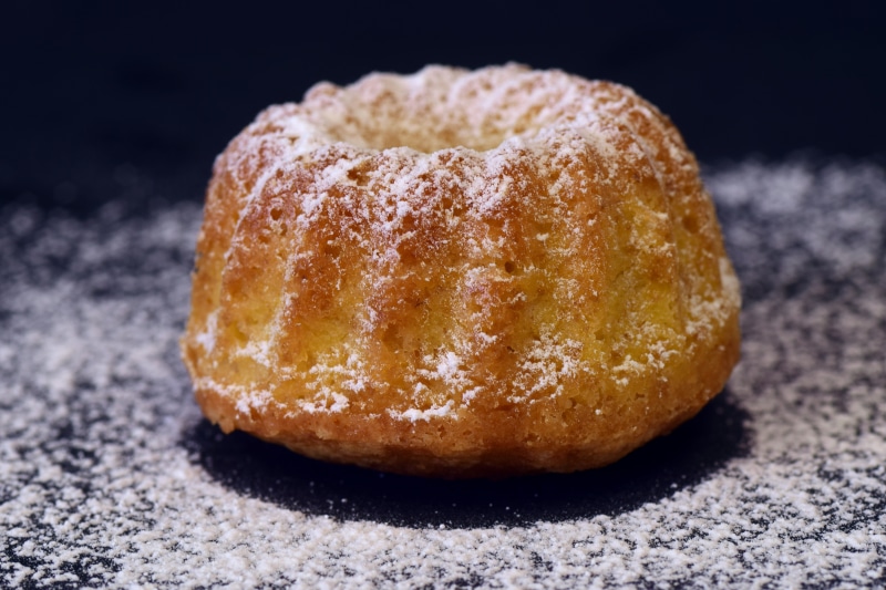food and drink, close-up, 5K, focus on foreground, sponge cake, snack, dessert, pastries, temptation, melted, delicious, indulgence, cake, icing sugar