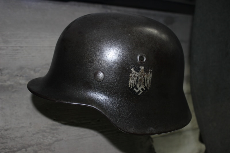 single object, protection, army, government, no people, War, work Helmet, metal, indoors, security, Helmet, representation, Swastika, art and craft, architecture